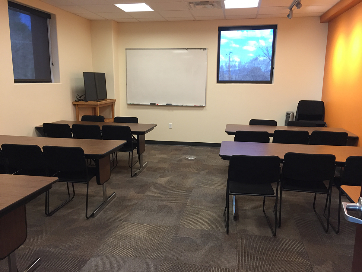 Founder's Room with classroom style seating and whiteboard