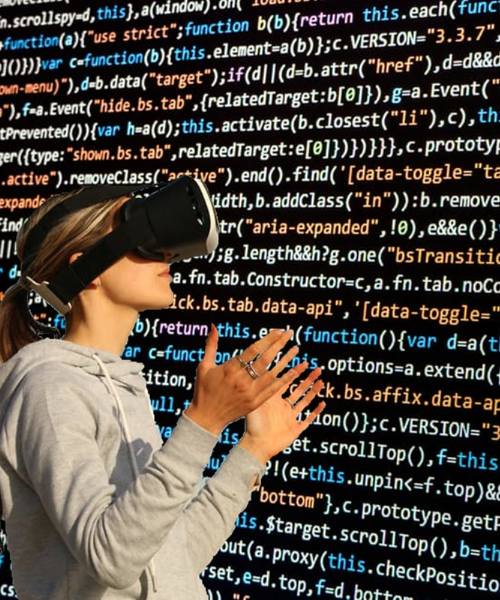 Girl wearing virtual reality set looking at codes.