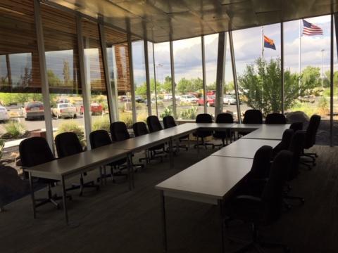 Glassford Hill room with glass walls and tables set up in U-shape