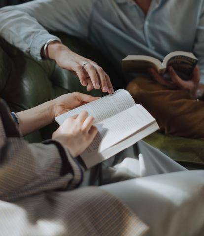 Two people reading books