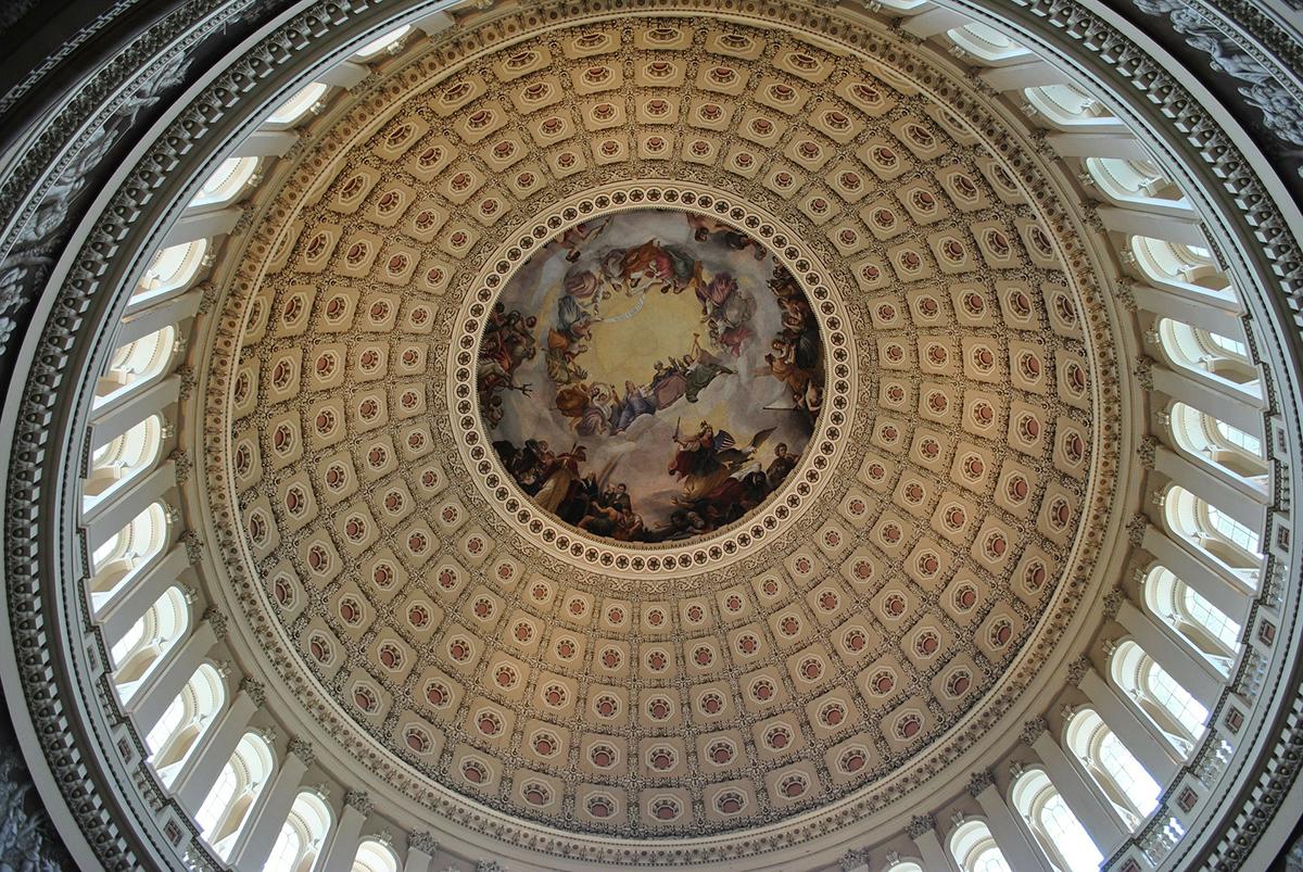 Intricate government building ceiling with dome shape and painting