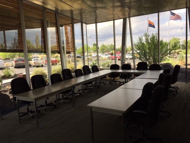 Glassford Hill room with glass walls and tables set up in U-shape